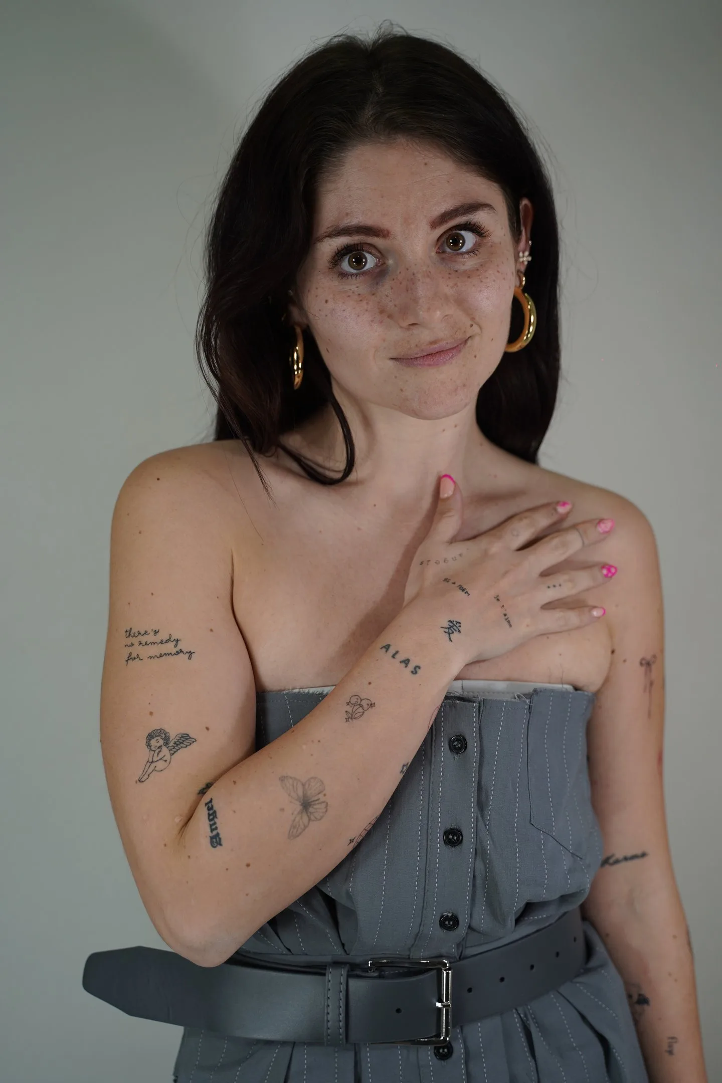 Fine line butterfly tattoo sized for an international traveller
