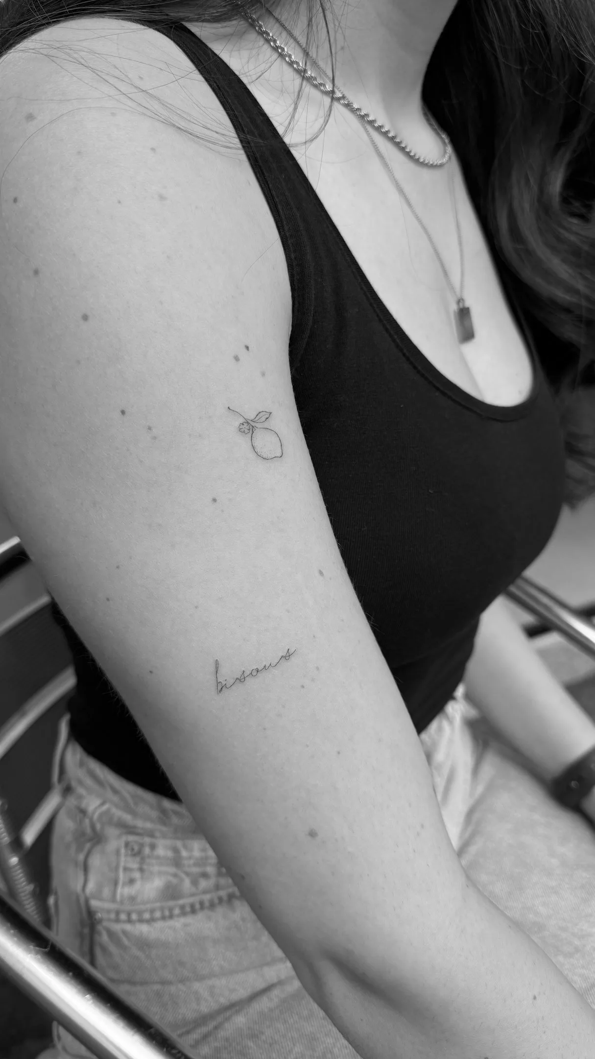Single continuous line rose tattoo on shoulder blade