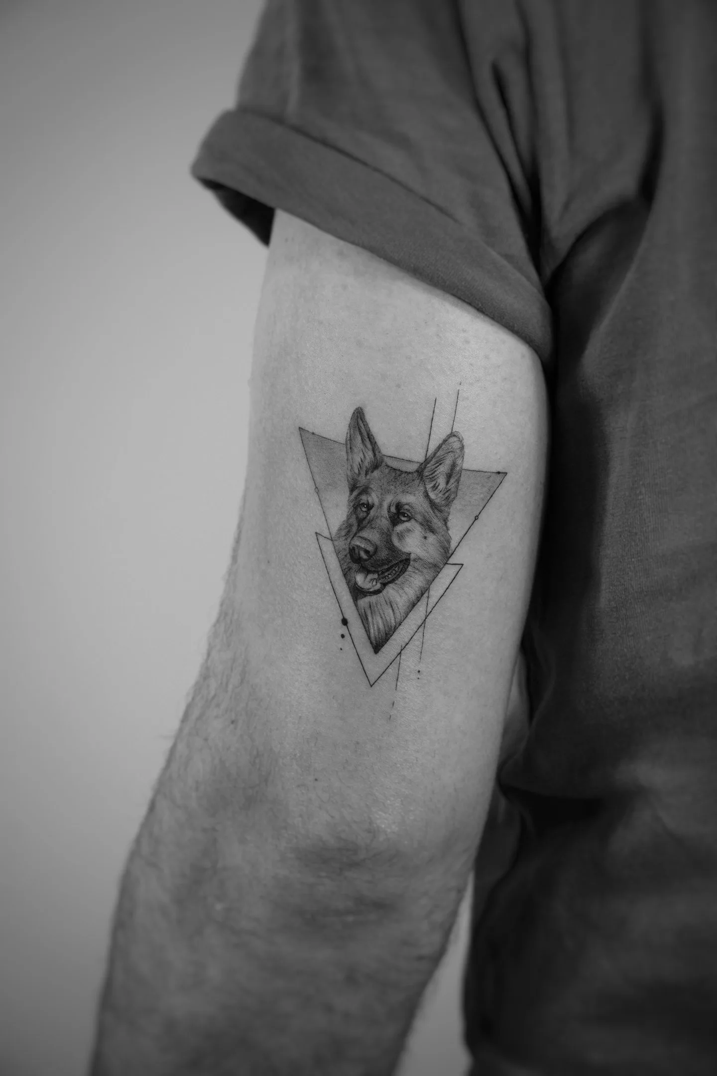 Minimalist lightning bolt fine line tattoo behind the ear