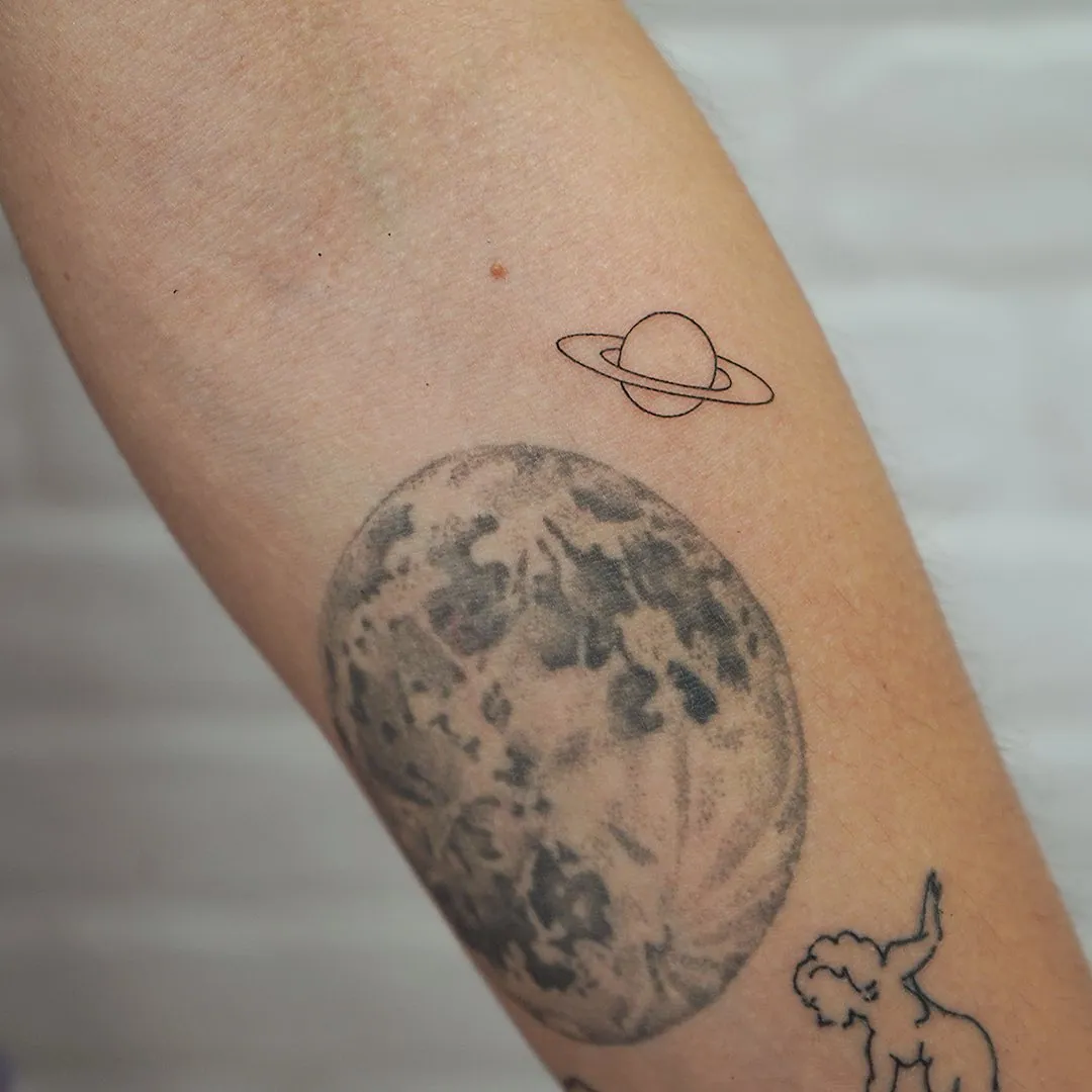 Microrealism tattoo Madrid — Tower Bridge and football stadium with detail