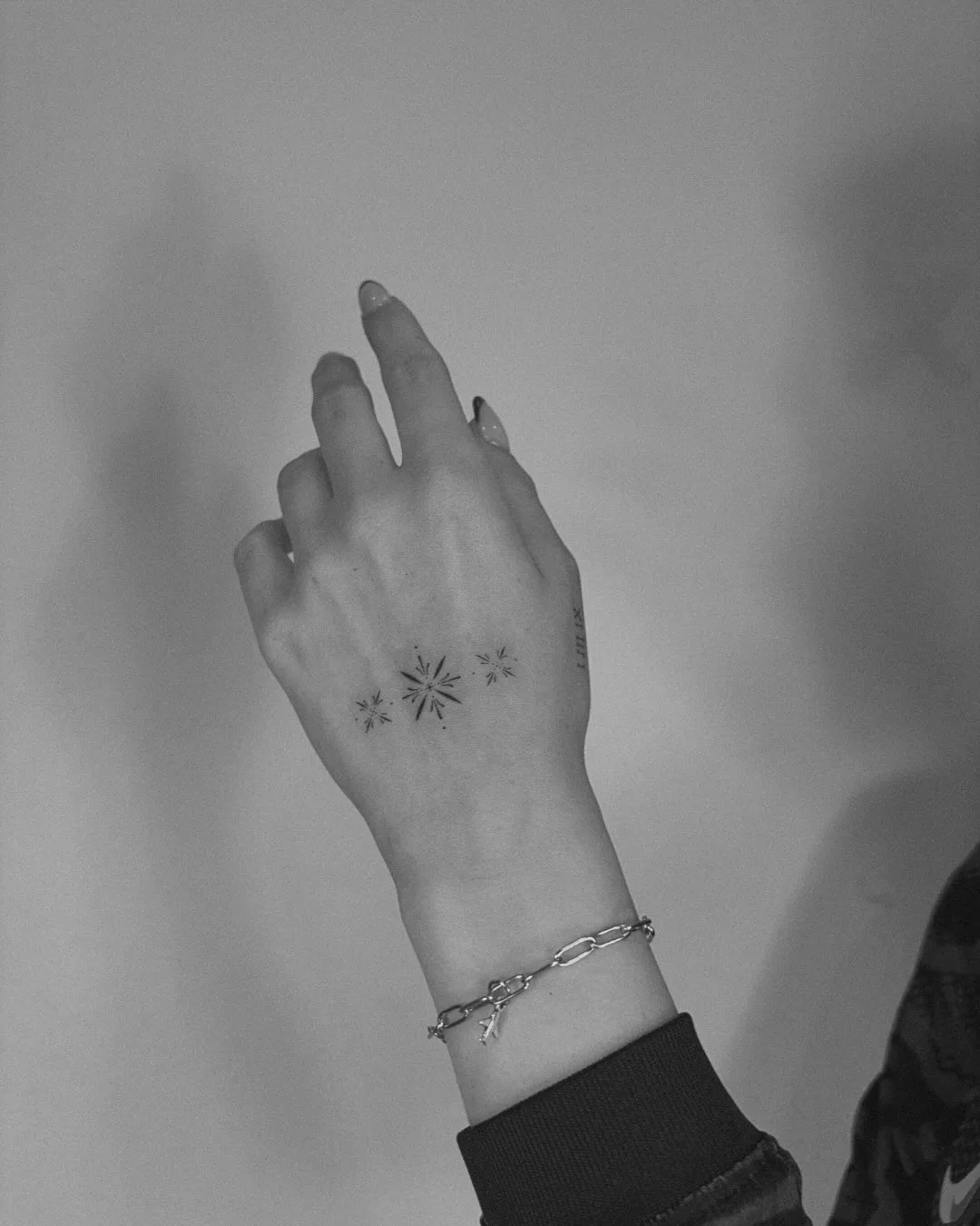 Ornamental fine line tattoo with symmetry and solid black Madrid