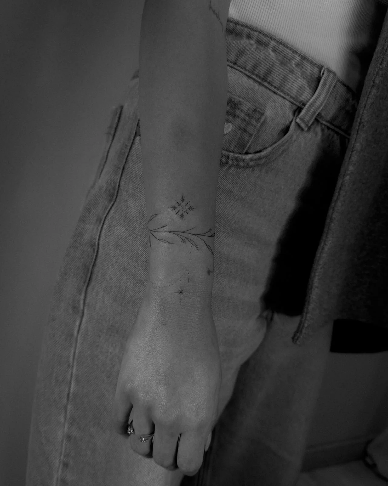 Ornamental fine line tattoo Madrid — technical precision and durability