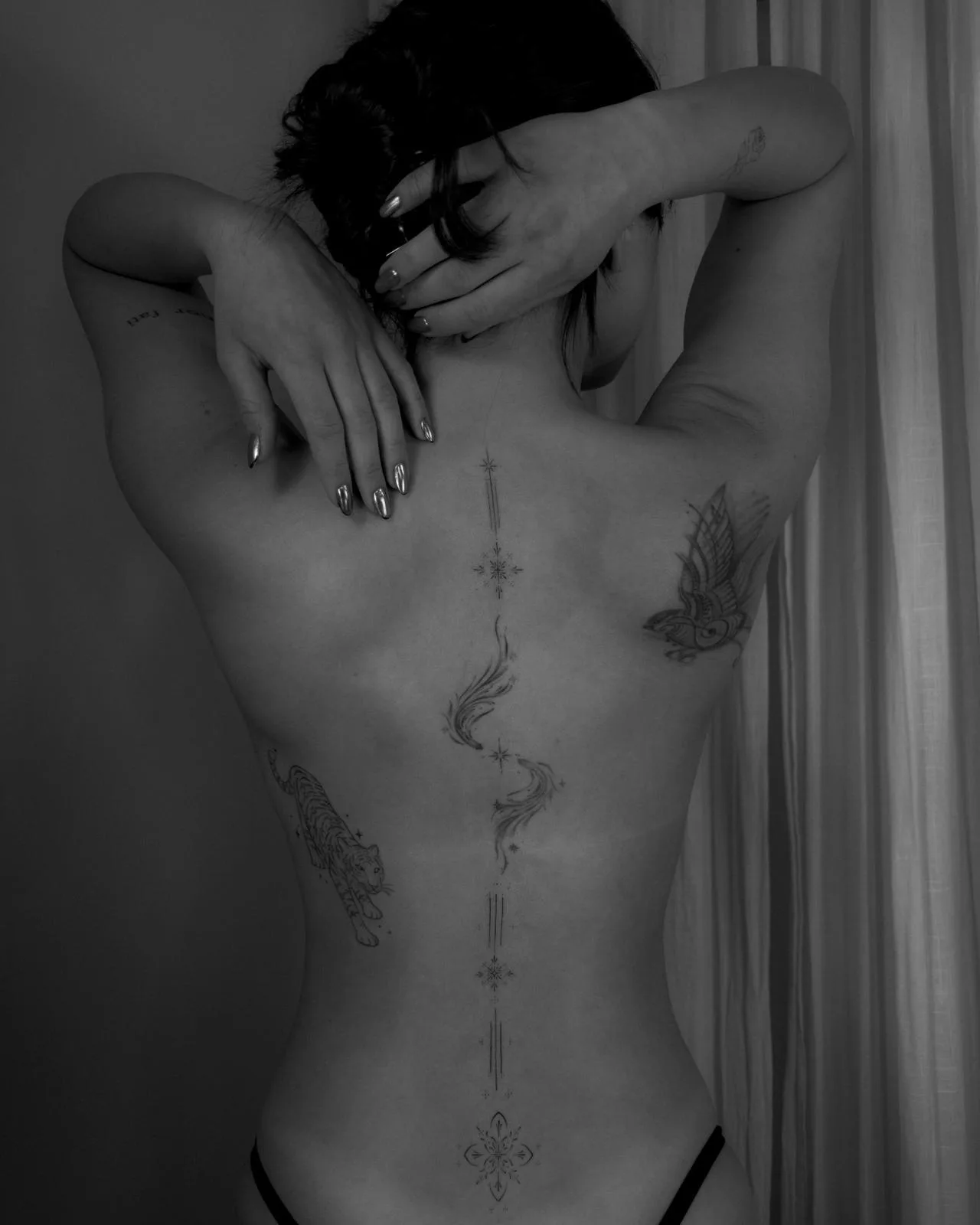 Symmetric geometric ornament with micro-detail dotwork on the arm